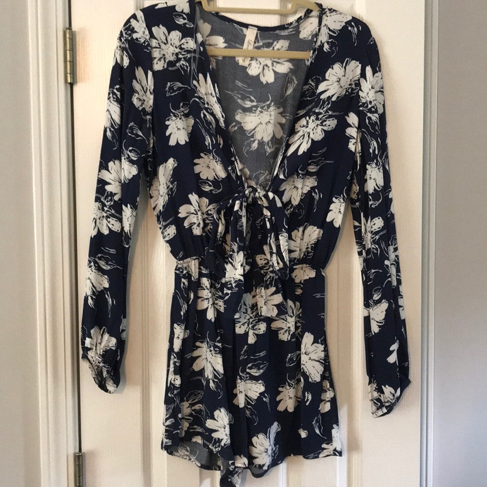 Navy and white tie front long sleeve floral romper